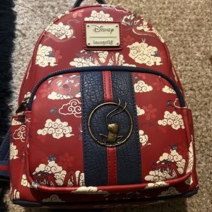 Loungefly Disney mushu Mulan bag. Has some wrinkles but good condition.